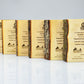 Angled view of a natural maple wood financial tombstone for corporate milestones