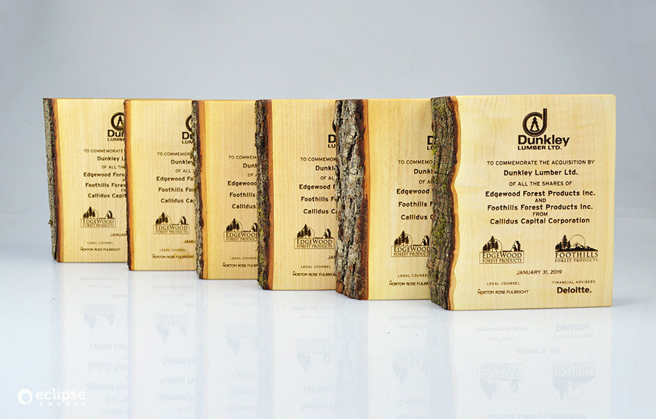Angled view of a natural maple wood financial tombstone for corporate milestones